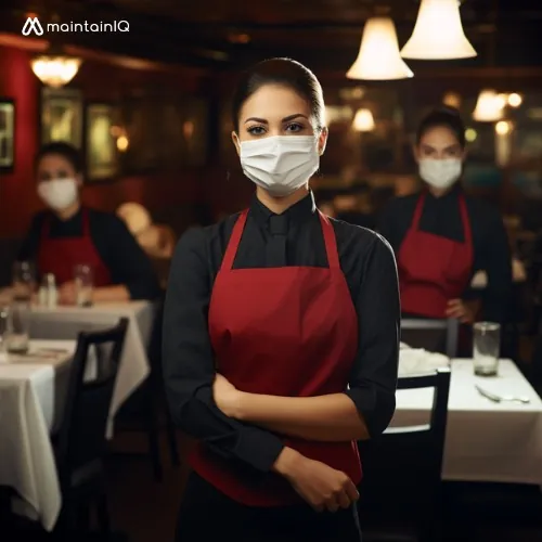 Restaurant employee washing hands at a handwashing sink
